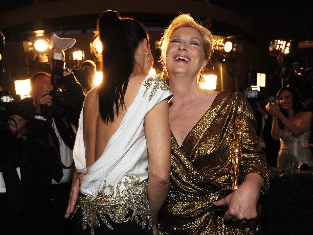 US actresses Meryl Streep (R) and Sandra Bullock laugh as they arrive at the Governor's Ball after the 84th Annual Academy Awards on February 26, 2012 in Hollywood, California. AFP PHOTO/Valerie MACON (Photo credit should read VALERIE MACON/AFP via Getty Images)