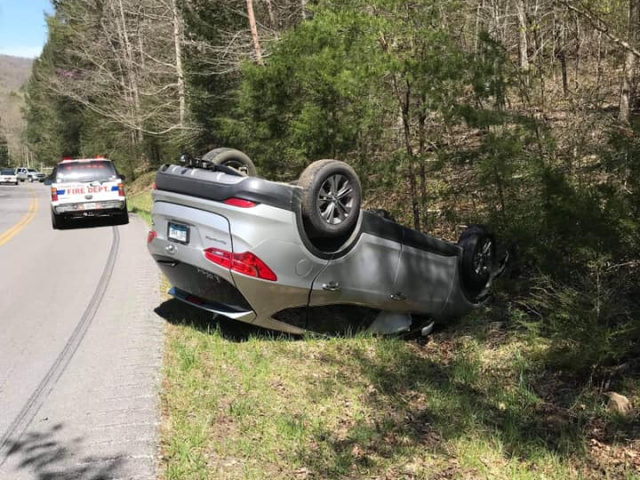 Volunteer firefighters pulled an injured man out of an overturned vehicle Friday in Frakes, Kentucky, after he crawled inside for a Bible.