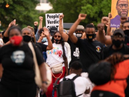 People march following the guilty verdict in the trial of Derek Chauvin on April 20, 2021, in Atlanta, Georgia. - Derek Chauvin, a white former Minneapolis police officer, was convicted on April 20 of murdering African-American George Floyd after a racially charged trial that was seen as a pivotal test …