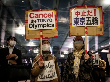TOKYO, JAPAN - MARCH 25: Demonstrators protest against the Tokyo Olympics outside the buil