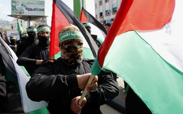 Abbas delays Palestinian elections; Hamas slams 'coup ...