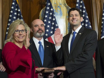 House Speaker Paul Ryan of Wis. administers the House oath of office to Rep. Liz Cheney, R-Wyo., during a mock swearing in ceremony on Capitol Hill, Tuesday, Jan. 3, 2017, in Washington. Her father, former Vice President Dick Cheney is at right. (AP Photo/Zach Gibson)