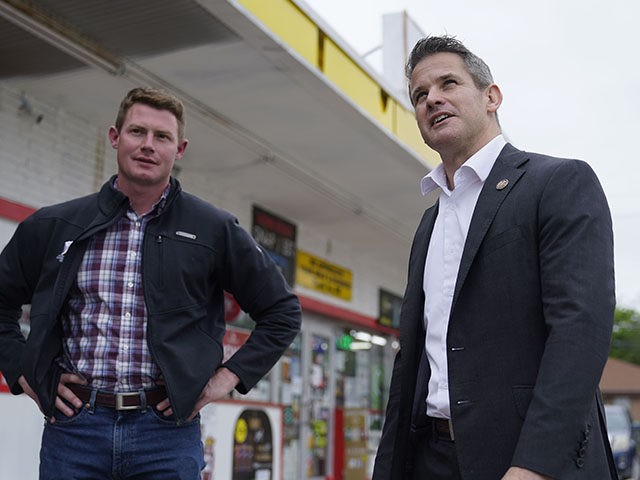 Rep. Adam Kinzinger, R-Ill., right, stands with Texas congressional candidate Michael Wood after they met for lunch, Tuesday, April 27, 2021, in Arlington, Texas. Wood is considered the anti-Trump Republican Texas congressional candidate that Kinzinger has endorsed in the May 1st special election for the 6th Congressional District. (AP Photo/LM …