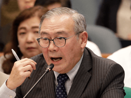 In this Feb. 6, 2020, file photo, Philippine Secretary of Foreign Affairs Teodoro Locsin Jr. gestures during a senate hearing in Manila, Philippines. The Philippine government has protested the Chinese coast guard's harassment of Philippine coast guard ships patrolling a disputed shoal in the South China Sea, the Department of …