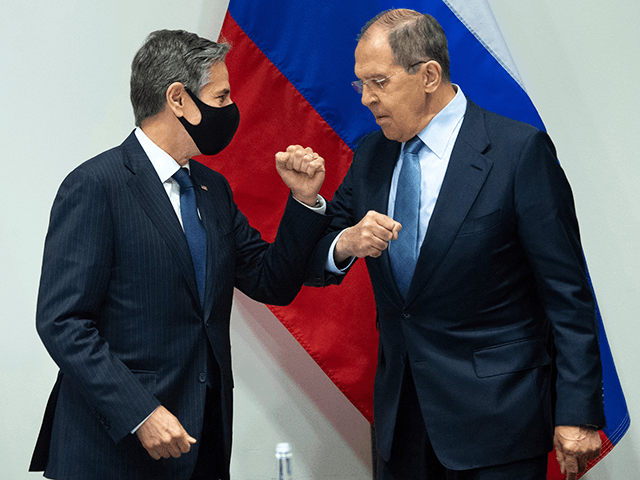 U.S. Secretary of State Antony Blinken, left, greets Russian Foreign Minister Sergey Lavrov, right, as they arrive for a meeting at the Harpa Concert Hall in Reykjavik, Iceland, Wednesday, May 19, 2021, on the sidelines of the Arctic Council Ministerial summit. (Saul Loeb/Pool Photo via AP)