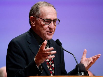 Alan Dershowitz toasts Avital Sharansky, not seen, at the American Jewish Historical Society 2013 Emma Lazarus Statue of Liberty Awards event, Tuesday, May 28, 2013, in New York. (John Minchillo/AP Images for American Jewish Historical Society)
