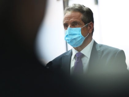 Gov. Andrew Cuomo listens as Alan Steel, president and CEO of the New York Convention Cent