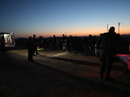 Border Patrol agents apprehend a large group of migrants in the Arizona Desert. (U.S. Border Patrol/Yuma Sector)