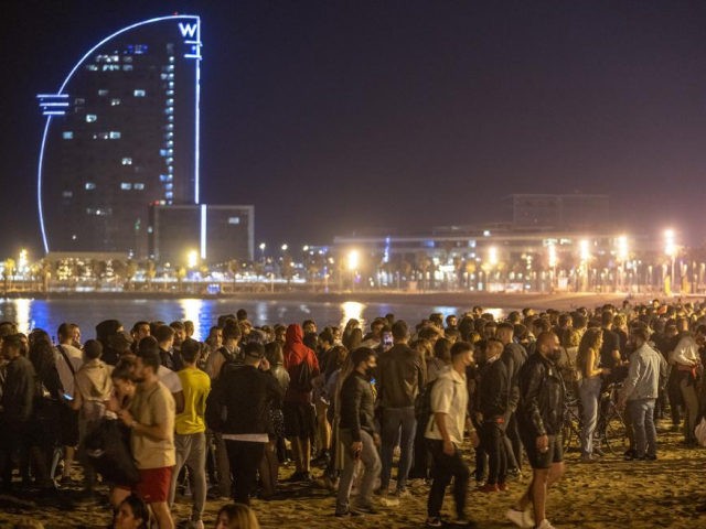 People crowded on the beach in Barcelona, Spain, Sunday, May 9, 2021. Barcelona residents