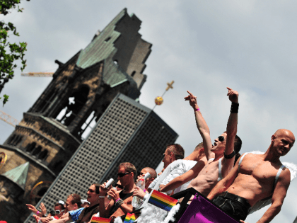 Participants of the Christopher Street Day (CSD) gay pride parade celebrate in front of Berlin's Memorial Church (Gedaechtniskirche) in Berlin on June 19, 2010. Gays and lesbians around the world celebrate the Christopher Street Day (CSD) gay and lesbian pride parade, arguably the most important date in their calendar. AFP …