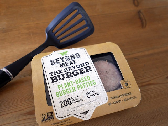 In this June 26, 2019, file photo, a package of meatless burgers by Beyond Meat are seen in Orlando, Fla. Beyond Meat reports financial earns Monday, July 29. (AP Photo/John Raoux, File)