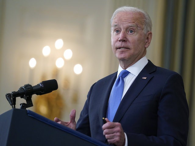 President Joe Biden takes questions from reporters as he speaks about the American Rescue