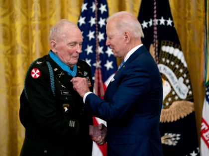 WASHINGTON, DC - MAY 21: U.S. President Joe Biden presents the Medal of Honor to Army Colonel Ralph Puckett in the East Room of the White House May 21, 2021 in Washington, DC.. Army Colonel Ralph Puckett is a decorated combat veteran who served in the army during the Korean …