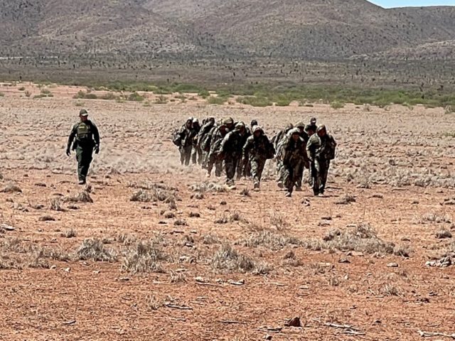 Border Patrol agents apprehend a large group of migrants marching through the Big Bend Sector desert. (Photo: U.S. Border Patrol/Big Bend Sector)