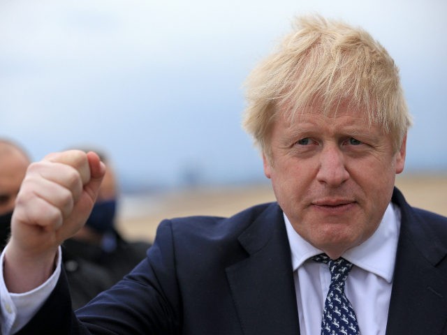HARTLEPOOL, ENGLAND - MAY 03: Britain's Prime Minister Boris Johnson makes a clenched fist as he campaigns on behalf of Conservative Party candidate Jill Mortimer (unseen) ahead of the 2021 Hartlepool by-election to be held on May 6 on May 3, 2021 in Hartlepool, north-east England. (Photo by Lindsey Parnaby …