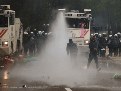 Police Break Up Outdoor Anti-Lockdown Party with Tear Gas, Water Cannon, 132 Arrests