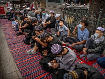 BEIJING, CHINA - MAY 13: Hui Muslim men gather during Eid al-Fitr prayers at the historic Niujie Mosque on May 13, 2021 in Beijing, China. Islam in China dates back to the 10th century as the legacy of Arab traders who ventured from the Middle East along the ancient Silk …