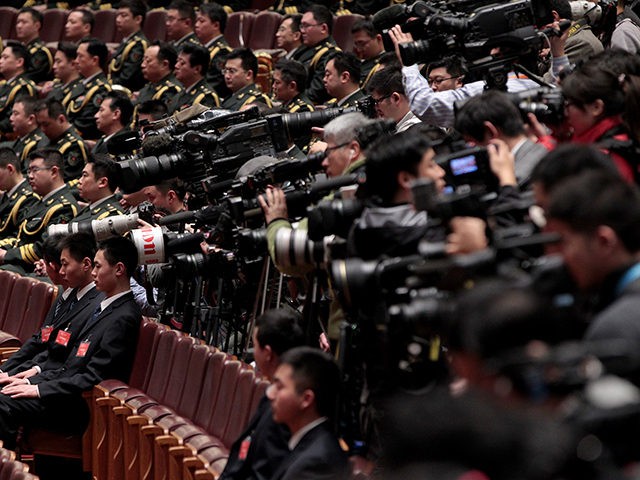BEIJING, CHINA - MARCH 03: (CHINA OUT) Members of the media work during the opening session of the Chinese People's Political Consultative Conference at the Great Hall of the People on March 3, 2013 in Beijing, China. Over 2,000 members of the 12th National Committee of the Chinese People's Political …