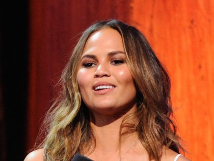 Yassir Lester and Chrissy Teigen speak onstage at the 2014 MTV Upfront, on Thursday, April 24, 2014 at the Beacon Theater in New York. (Photo by Charles Sykes/Invision for MTV/AP Images)