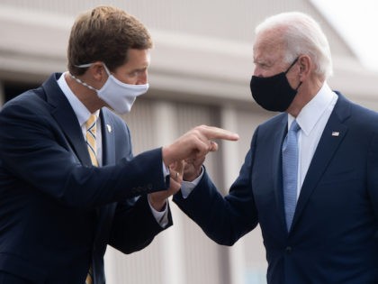 Democratic presidential nominee former US Vice President Joe Biden (R) speaks with US Representative Conor Lamb, Democrat of Pennsylvania, as he walks to board an airplane at Allegheny County Airport in West Mifflin, Pennsylvania, August 31, 2020, following travel to Pennsylvania for campaign events. (Photo by SAUL LOEB / AFP) …