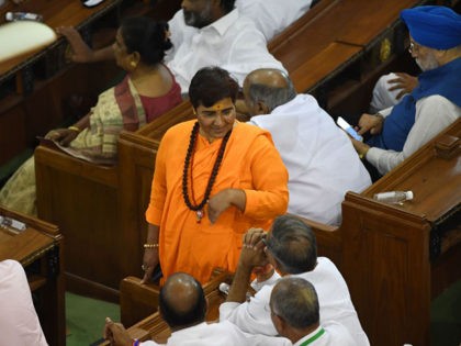 Indian Bharatiya Janata Party (BJP) and newly elected member of parliament for Bhopal constituency Pragya Singh Thakur (C), known as Sadhvi Pragya, attends a National Democratic Alliance (NDA) meeting at the central hall of the parliament, in New Delhi on May 25, 2019. - Modi has been formally elected as …
