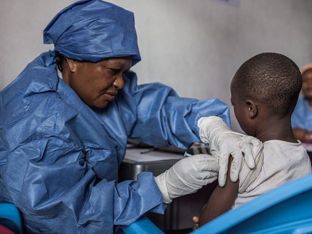 A girl is getting inoculated with an Ebola vaccine on November 22, 2019 in Goma. (Photo by PAMELA TULIZO / AFP) (Photo by PAMELA TULIZO/AFP via Getty Images)
