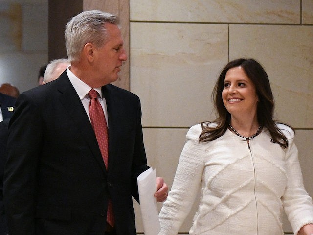 House Minority Leader Kevin McCarthy (L) walks with Representative Elise Stefanik (R-NY) a