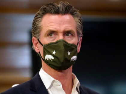 California Gov. Gavin Newsom waits to speak at Hanzo Sushi Thursday, April 29, 2021, in Sa