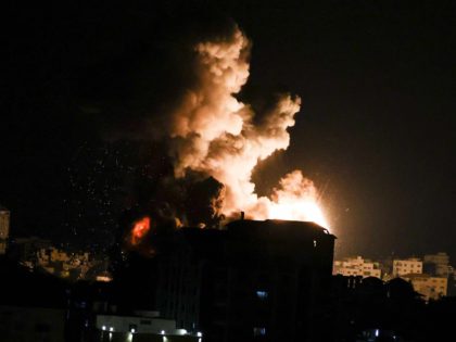 TOPSHOT - Fire billows from Israeli air strikes in the Gaza Strip, controlled by the Palestinian Islamist movement Hamas, on May 13, 2021. - Around 1,500 rockets have been fired from Gaza into Israeli cities since hostilities escalated between Hamas militants and Israel earlier in the week, Israel's army said …