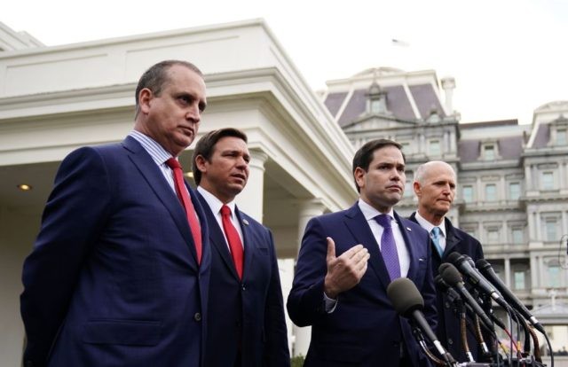 US senators Marco Rubio (C) and Rick Scott (R) along with Representative Mario Diaz-Balart (L) and Florida Governor Ron DeSantis, speak to reporters after a meeting with US President Donald Trump on Venezuela, outside of the West Wing of the White House in Washington, DC on January 22, 2019. (Photo …