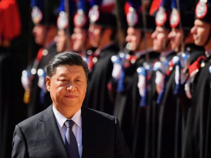 China's President Xi Jinping reviews Italian Carabinieri during a welcoming ceremony upon his arrival for a meeting with Italys Prime Minister at Villa Madama in Rome on March 23, 2019 as part of a two-day visit to Italy. (Photo by Alberto PIZZOLI / AFP) (Photo credit should read ALBERTO PIZZOLI/AFP …