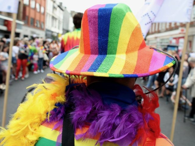 A member of the Lesbian, Gay, Bisexual and Transgender (LGBT) community takes part in the Belfast Pride Parade 2019 in Belfast, Northern Ireland on August 3, 2019. - Northern Ireland's LGBT community take to the streets of Belfast in Pride celebrations buoyed by the promise that same-sex marriage rights will …