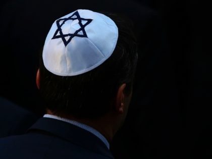 A man wearing a kippah Jewish skullcap arrives at the synagogue in Halle, eastern Germany, on October 10, 2019, one day after the attack where two people were shot dead. - German leaders visited the scene of the deadly anti-Semitic gun attack carried out on the holy day of Yom …