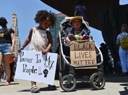 Families participate in a children's march in solidarity with the Black Lives Matter movement and national protests against police brutality on June 9, 2020 in the Brooklyn Borough of New York City. - George Floyd will be laid to rest Tuesday in his Houston hometown, the culmination of a long …