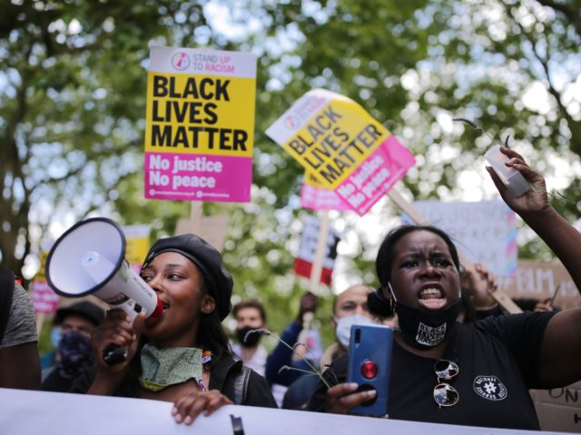 LONDON, ENGLAND - JUNE 13: Anti-racism protesters attend a Black Lives Matter demonstration on June 13, 2020 in London, England. A number of anti-racism protesters have gathered in London despite the cancellation of the official event due to fears of clashes with far-right groups. Following a social media post by …