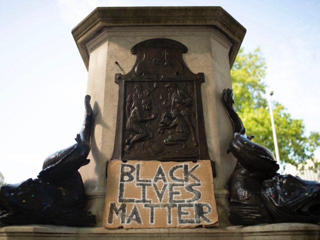 BRISTOL, ENGLAND - JUNE 16: The Edward Colston statue plinth with a sign saying "Black Lives Matter" on June 16, 2020 in Bristol, England. A statue of slave trader Edward Colston was pulled down and thrown into Bristol Harbour during Black Lives Matter protests sparked by the death of an …
