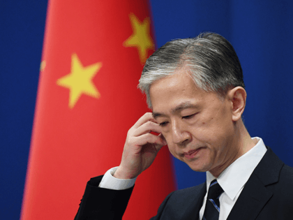 Chinese Foreign Ministry spokesman Wang Wenbin listens to a question at the daily Foreign Ministry briefing in Beijing on July 24, 2020. - China on July 24 ordered the US consulate in the southwestern city of Chengdu to close in retaliation for one of its missions in the United States …