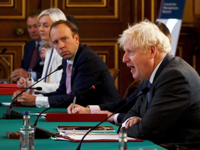 LONDON, ENGLAND - SEPTEMBER 15: British Prime Minister Boris Johnson (R) speaks as Secretary of State for Health and Social Care, Matt Hancock (C) listens during a Cabinet Meeting at the Foreign & Commonwealth Office on September 15, 2020 in London, England. (Photo by Jonathan Buckmaster - WPA Pool/Getty Images)