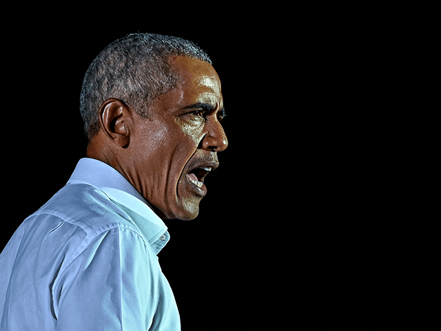 Former US President Barack Obama speaks at a drive-in rally as he campaigns for Democratic