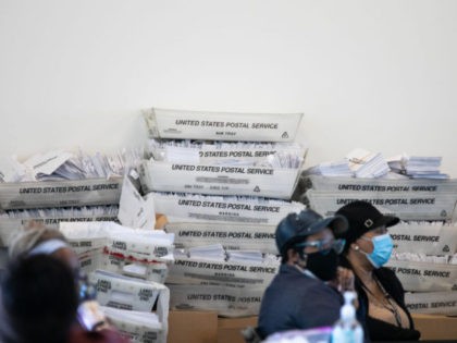 ATLANTA, GA - NOVEMBER 06: Security envelopes for absentee ballots sit in stacked boxes as