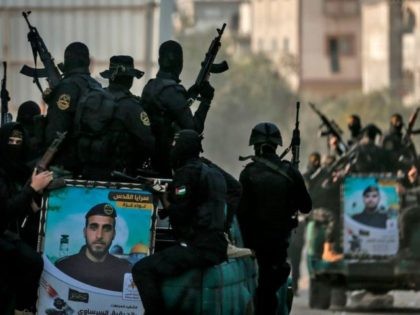 Palestinian Islamic Jihad militants take part in a military rally in Gaza City on November 12, 2020, to mark the first anniversary of the killing of the group's commander Baha Abu Al-Ata in a strike on his home in the Gaza Strip. (Photo by MAHMUD HAMS / AFP) (Photo by …