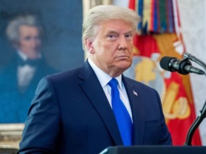 TOPSHOT - US President Donald Trump looks on during a ceremony presenting the Presidential