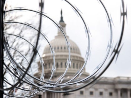 Barbed wire is installed on the top of a security fence surrounding the US Capitol in Washington, DC, January 15, 2021, ahead of next week's presidential inauguration of Joe Biden. (Photo by SAUL LOEB / AFP) (Photo by SAUL LOEB/AFP via Getty Images)