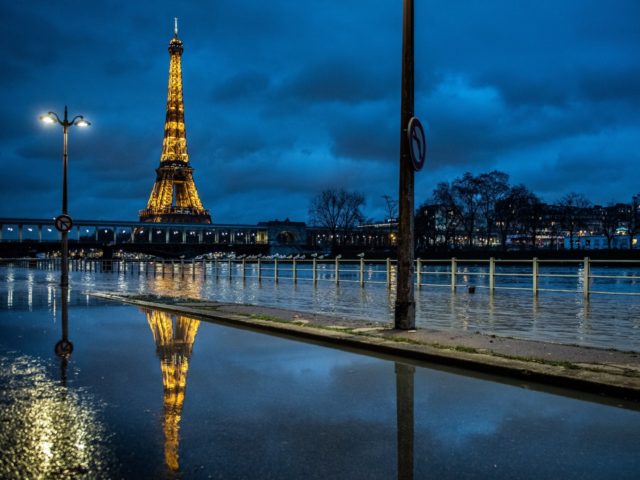 A picture taken on February 1, 2021 in Paris shows the flooded banks of the river Seine with the Eiffel tower in background. (Photo by Martin BUREAU / AFP) (Photo by MARTIN BUREAU/AFP via Getty Images)