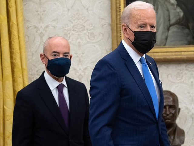 US President Joe Biden stands alongside Secretary of Homeland Security Alejandro Mayorkas