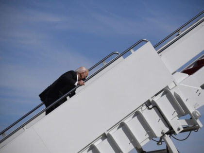 US President Joe Biden trips while boarding Air Force One at Joint Base Andrews in Maryland on March 19, 2021. - President Biden travels to Atlanta, Georgia, to tour the Centers for Disease Control and Prevention, and to meet with Georgia Asian American leaders, following the Atlanta Spa shootings. (Photo …