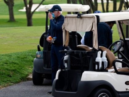 US President Joe Biden leaves his cart after a round of golf at Wilmington Country Club in Wilmington, Delaware, on April 17, 2021. - President Joe Biden played golf for the first time in his presidency Saturday, hitting the fairways in his home city of Wilmington. (Photo by JIM WATSON …