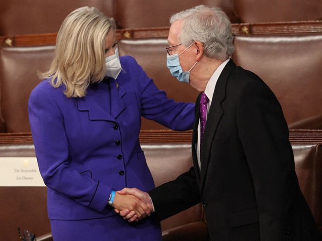 Rep. Liz Cheney, R-Wyo., greets Senate Minority Leader Mitch McConnell of Ky., as they wait for the start of President Joe Biden's first address to a joint session of Congress at the US Capitol in Washington, DC, on April 28, 2021. (Photo by JONATHAN ERNST / POOL / AFP) (Photo by JONATHAN ERNST/POOL/AFP via Getty Images)