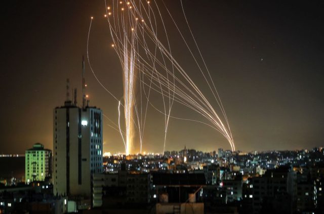 TOPSHOT - Rockets are launched from Gaza city, controlled by the Palestinian Hamas movement, in response to an Israeli air strike on a 12-storey building in the city, towards the coastal city of Tel Aviv, on May 11, 2021. (Photo by ANAS BABA / AFP) (Photo by ANAS BABA/AFP via …