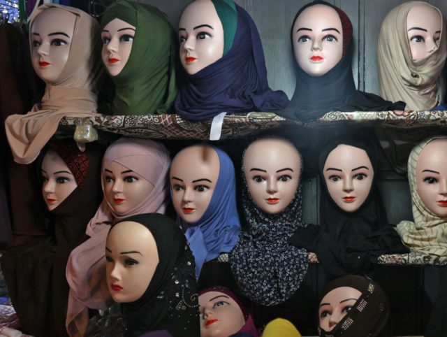A picture taken at a shop in Jerusalem's Old City on May 14, 2021 shows Muslim headdresses, including a nikab full face cover (R). (Photo by Ahmad GHARABLI / AFP) (Photo by AHMAD GHARABLI/AFP via Getty Images)